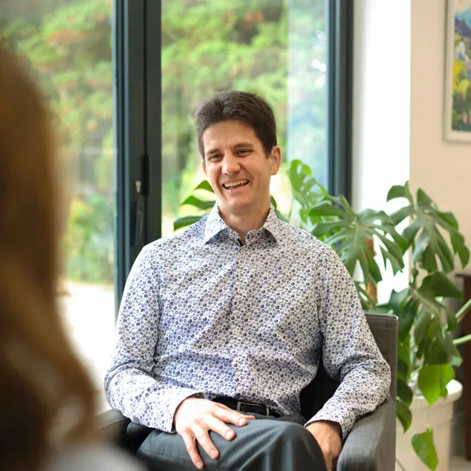 Duncan speaking with a client